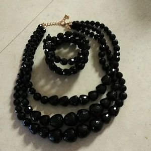 Black chunky necklace , bracelet and earrings.